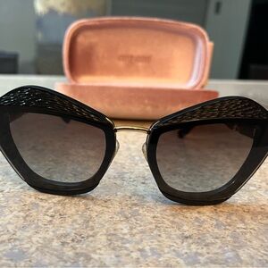 Miu Miu Black Sunglasses with Gold Accents